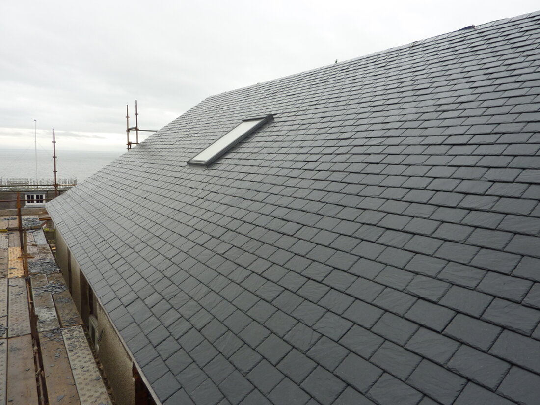 New slate and tile roof on a house
